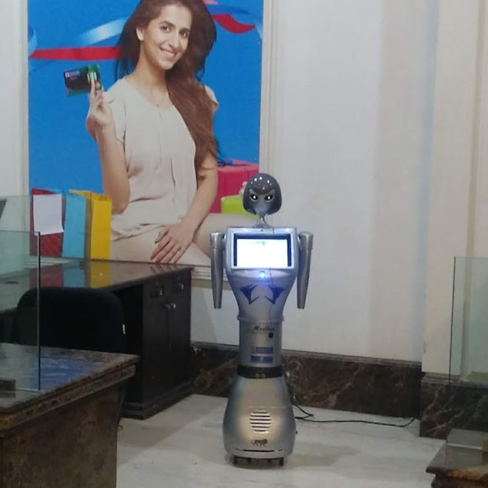 MeDHA robot at a client reception desk